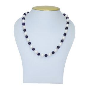 Finely crafted 19-inch long white round pearls necklace strung along with peach 2mm seed pearls accented with SP purple garnet beads