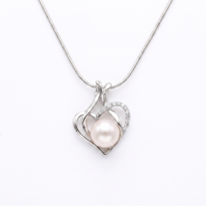 Lovely CZ Heart Pendant Accentuated With Peach Button Pearl