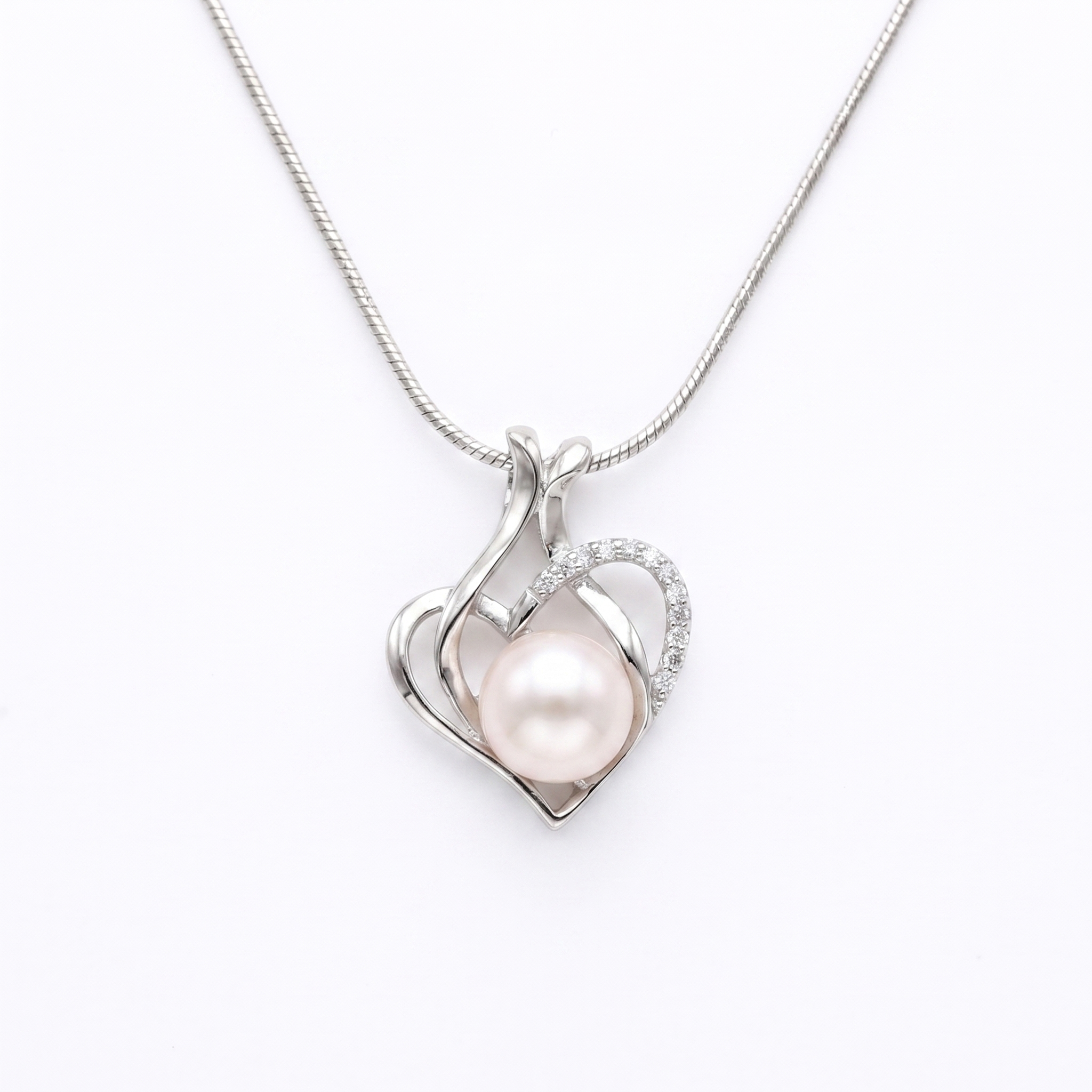 Lovely CZ Heart Pendant Accentuated With Peach Button Pearl