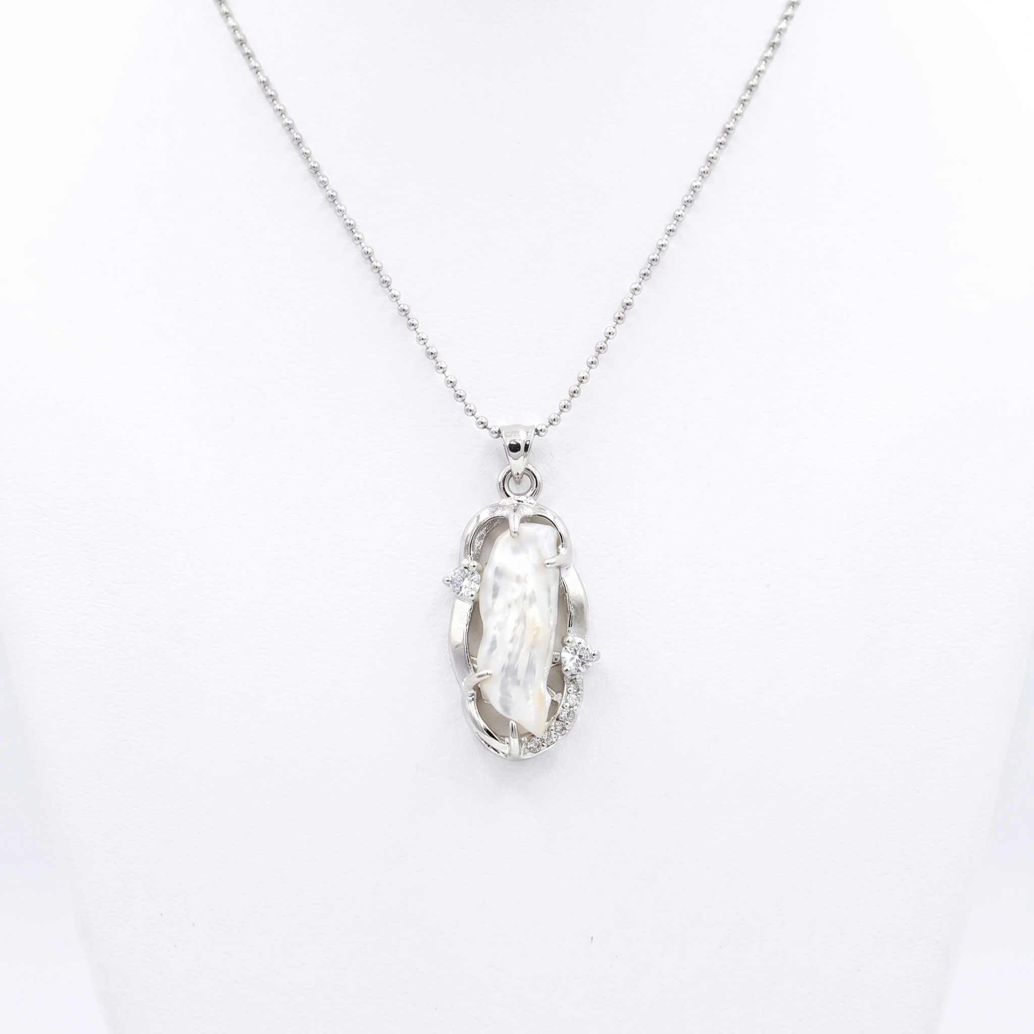 Artistic Silver Finish Pendant Accentuated With White Baroque Pearl & CZ