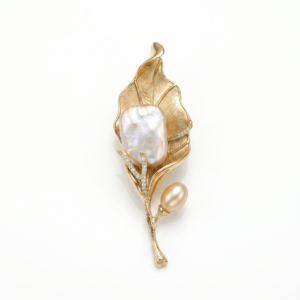Sophisticated Matte Golden Leafy Brooch With Baroque Pearl & CZ