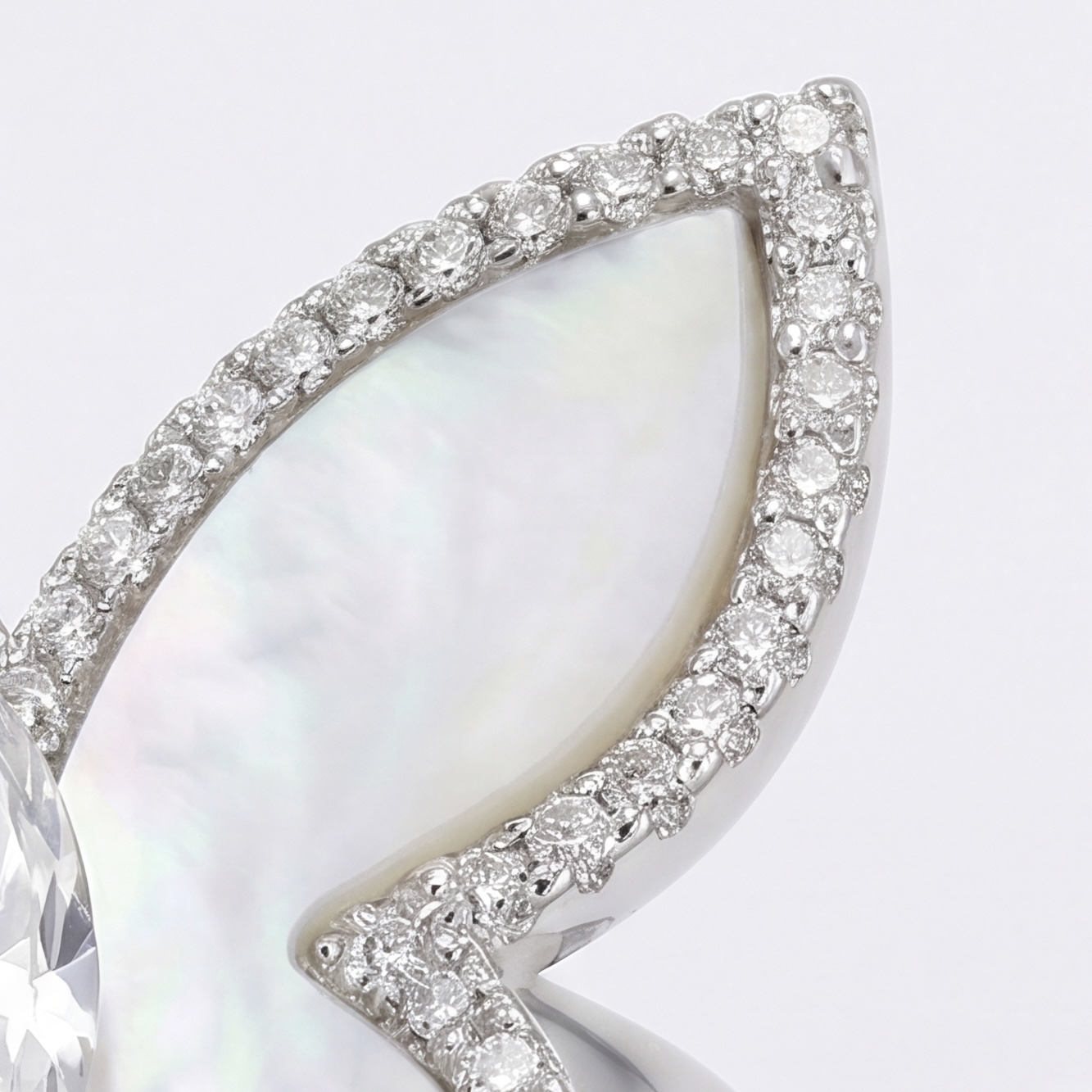 Detail of a mother of pearl wing with pavé American diamond (CZ) outline in silver - Pure Pearls
