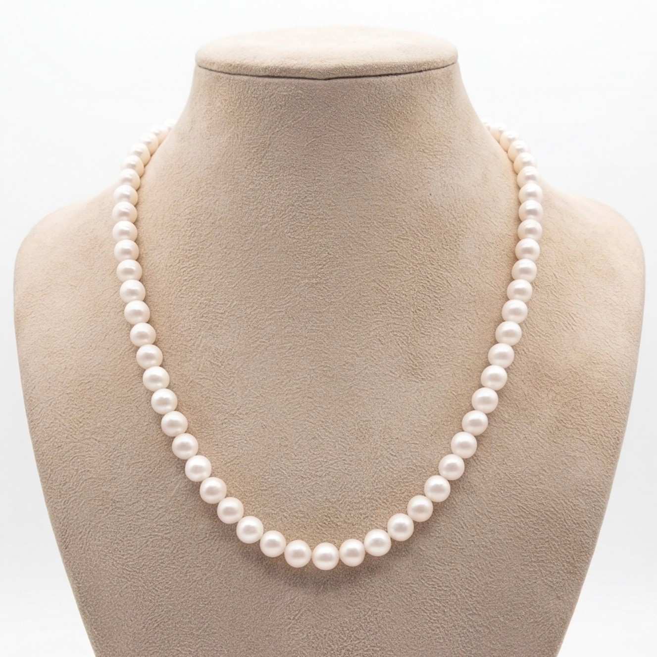 White round freshwater pearl single-line necklace displayed on a bust stand - Pure Pearls