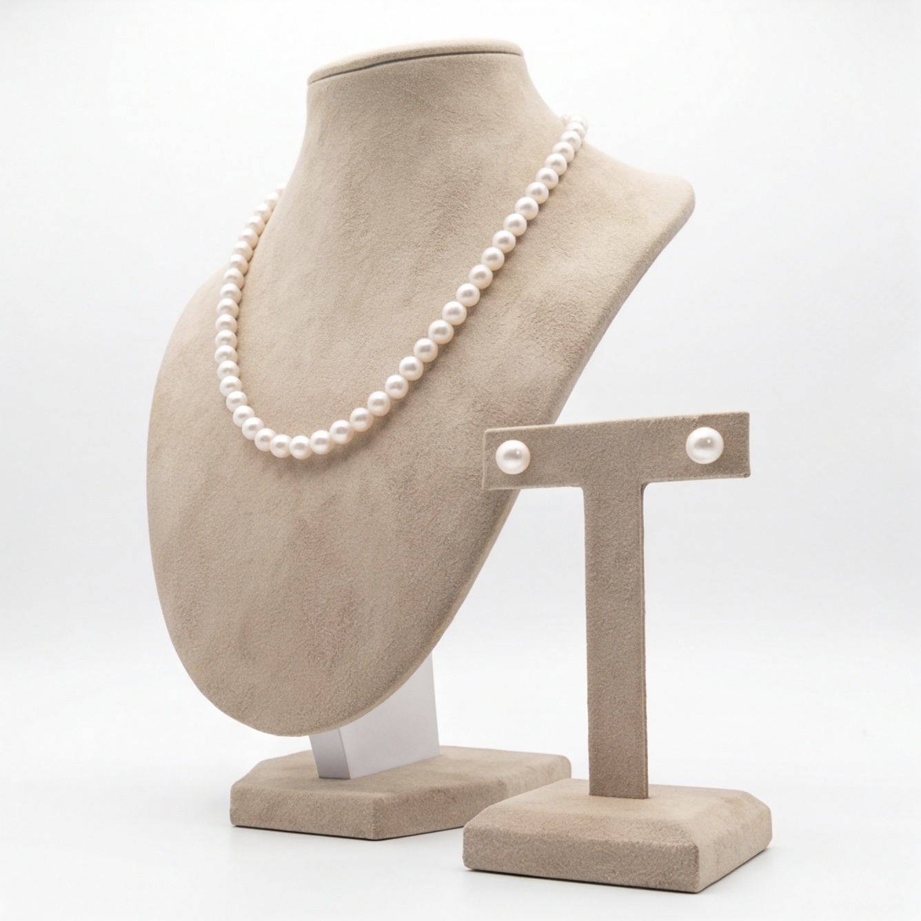 Angled view of white pearl necklace and matching pearl stud earrings set - Pure Pearls