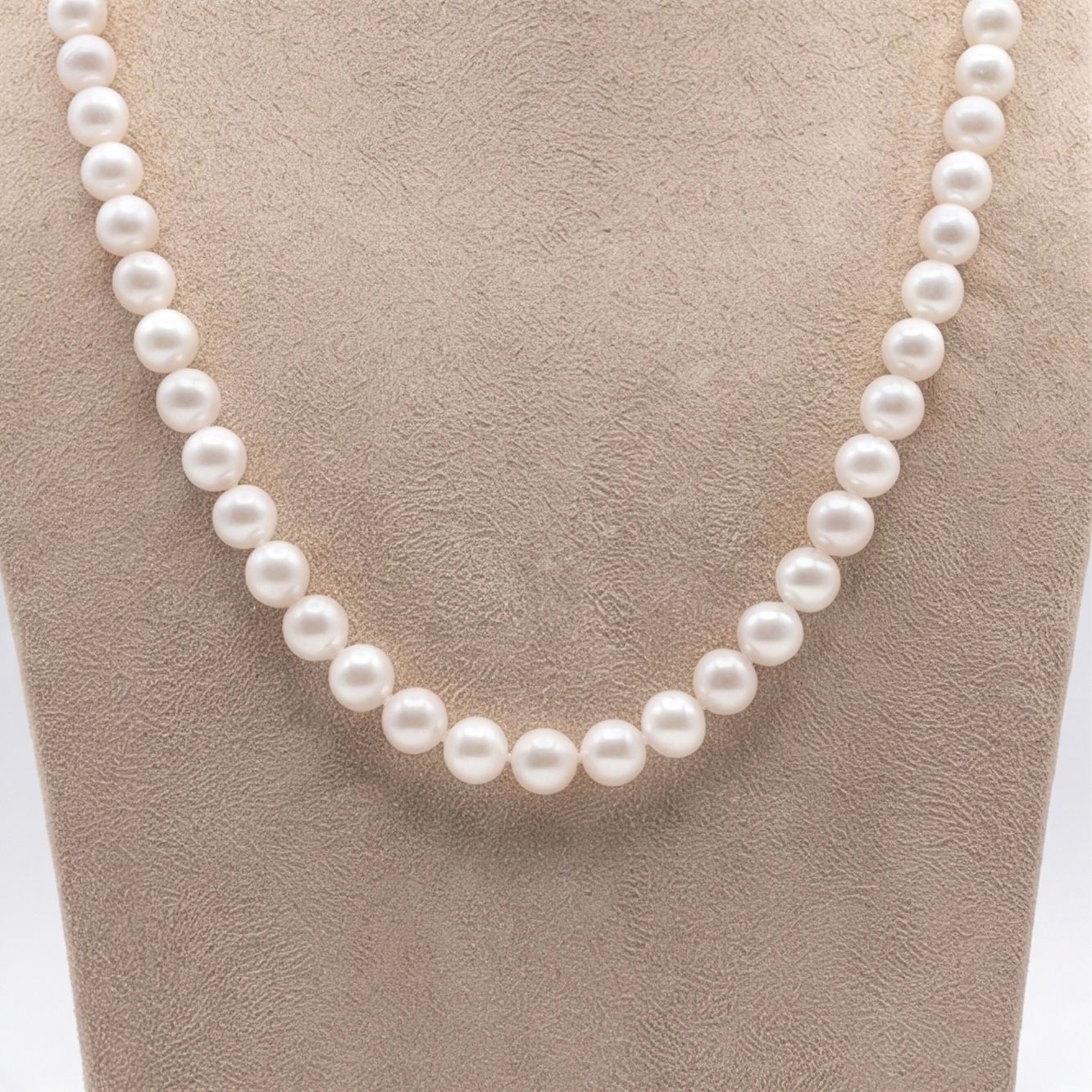 Close detail of white round pearls in a single-line matinee necklace - Pure Pearls