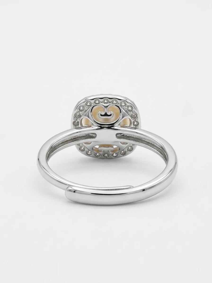 Back view of the peach pearl halo ring showing the open gallery and the adjustable band - Pure Pearls